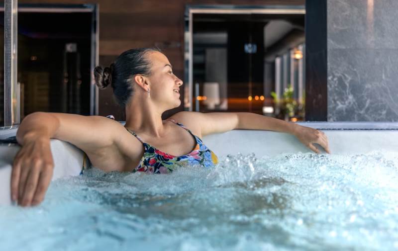 woman-relaxing-hot-tub-modern-spa-with-bubbles-quiet-relax-moment